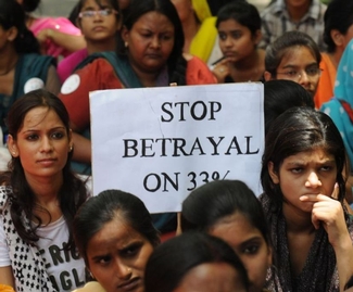 Members of women's organisations stage a protest in New Delhi to demand passage of the Women's reservation Bill in the Lok Sabha. 